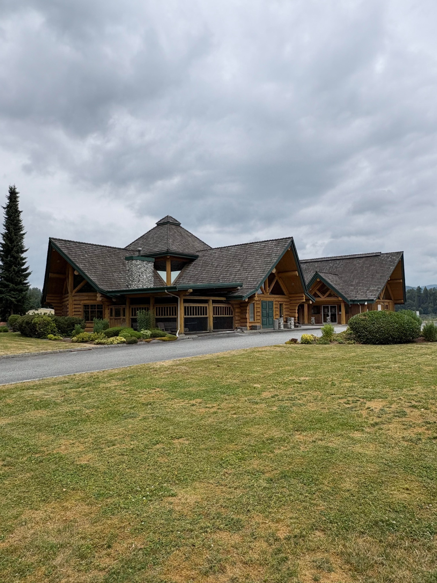 Andersen Pacific Forest Products main office — a log cabin building in a forest setting