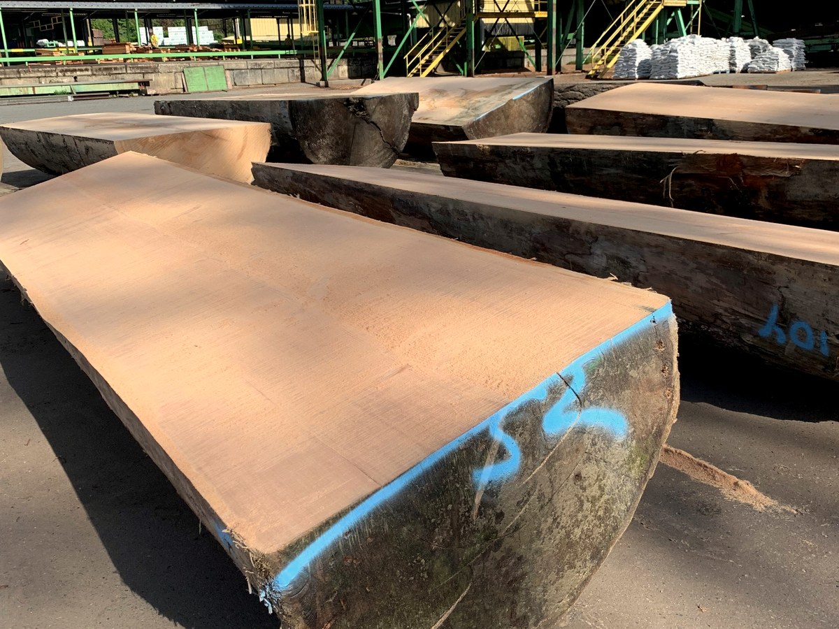Large-section timbers staged in the mill yard